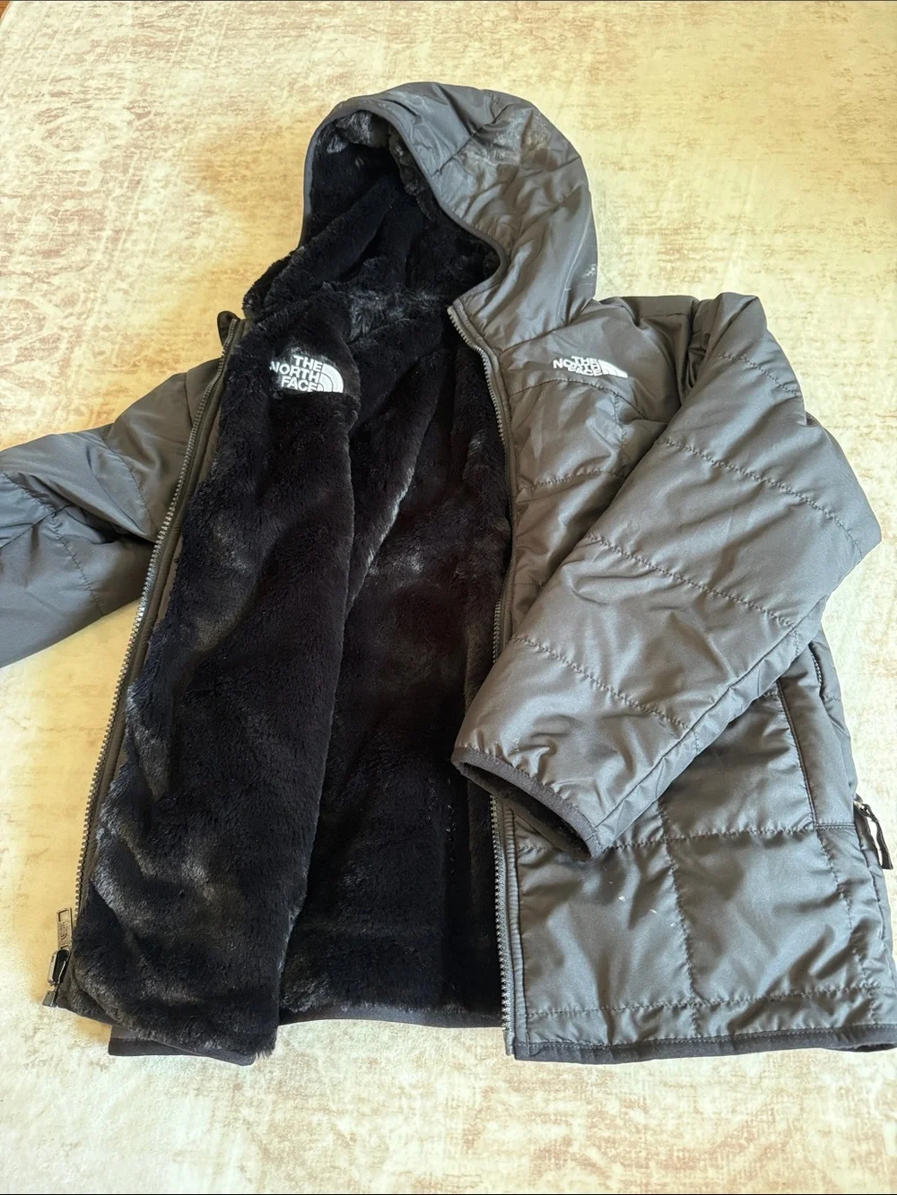 The North Face Children’s Hooded Faux-Fur Reversible Puffer Jacket in Black
